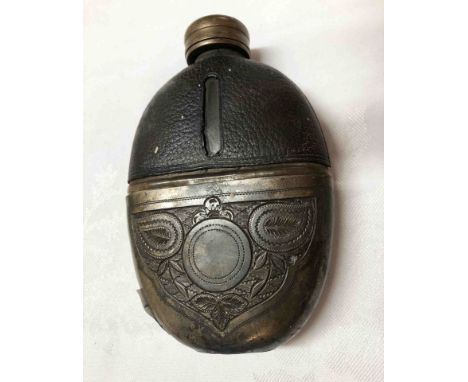 An old pocket spirit flask with chased silver plated half cup base and leather to top by J. Deakin &amp; Sons