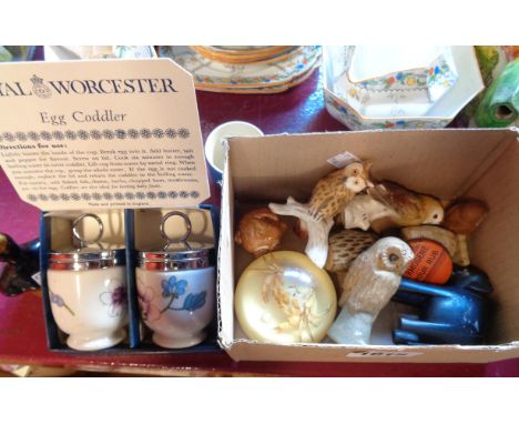 A box containing a small quantity of ceramic and other figurines including Goebel, owls, etc.