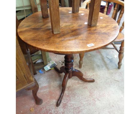 A 70cm diameter mahogany pedestal table, set on turned pillar and tripod base