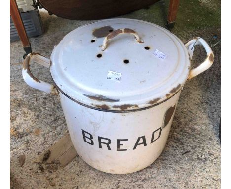 An old enamel bread bin with black lettering on a white ground