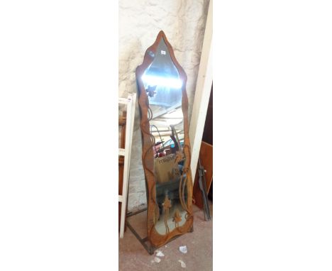 A Dean Forge decorative steel framed full length mirror with applied vines and shaped plate, set on a polished steel stand - 