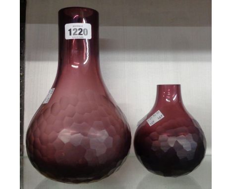 A large Caithness amethyst vase of bottle form with scale cut decoration - sold with a smaller similar