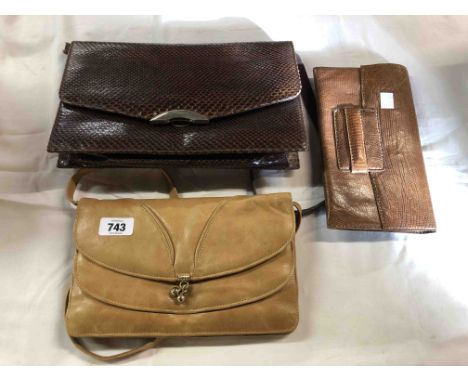 A vintage leather handbag - sold with two smaller similar