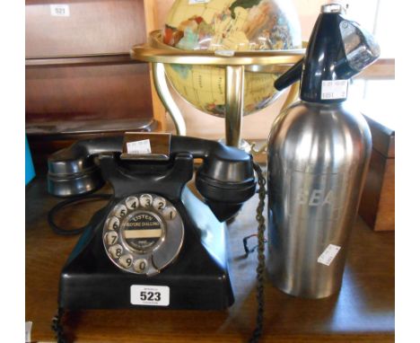 A vintage GEC bakelite telephone - sold with a vintage Sparklets soda syphon marked for BEA (British European Airways)