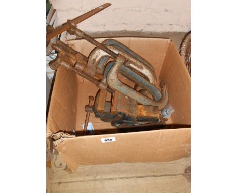 A box containing a quantity of tools, clamps and a vice