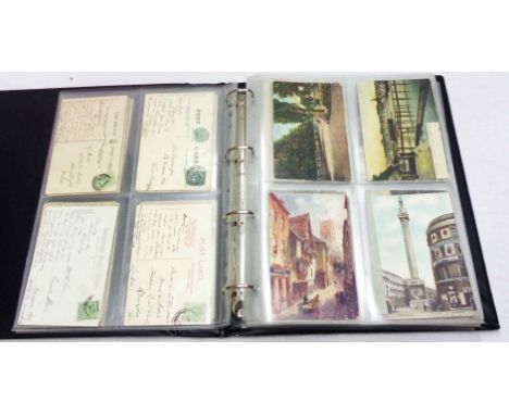 A green ring bound album containing a quantity of plastic sleeve mounted early 20th Century and later postcards including loc