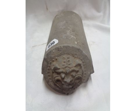 An old Korean pottery roof tile with face mask decoration