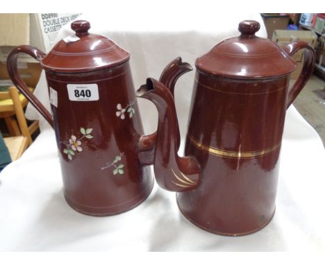 Two early 20th Century enamel coffee pots one with enamelled floral decoration and the other gilt banding