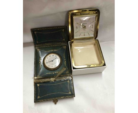 An old Swiss movement eight day travelling clock in fold-out leather case - sold with a boxed Europa-Uhren travelling alarm c
