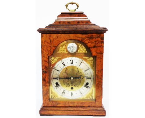 A reproduction figured walnut cased bracket clock, the 15cm brass dial with silver chapter ring and marked Elliott Clock unde