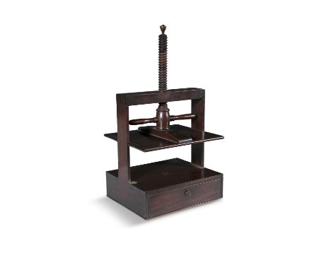 AN EARLY 19TH CENTURY MAHOGANY BOOK PRESS   with turn-screw press plate between upright posts, over a single deep drawer with