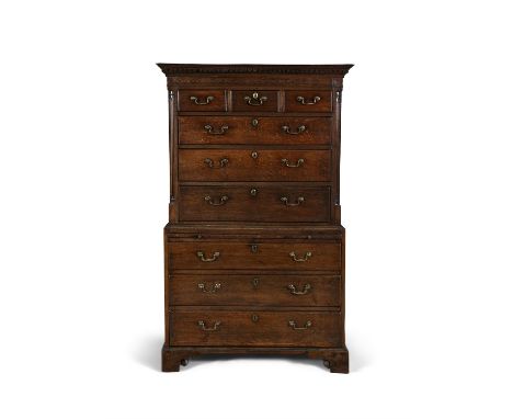 A GEORGE III OAK CHEST ON CHEST, C.1800  the moulded dentil cornice above three short and three long graduated drawers betwee
