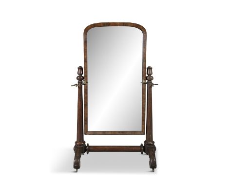 A VICTORIAN MAHOGANY FRAMED CHEVAL MIRROR,   the domed framed mirror on tapestry column side supports, with attached hinged c
