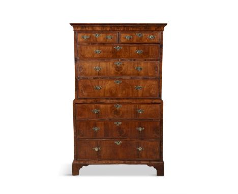 A GEORGE III WALNUT TALLBOY CHEST ON CHEST, C.1750  the top section with moulded cornice, above an arrangement of two short a