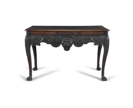 A FINE IRISH MAHOGANY GEORGE III HALL TABLE, C.1740   the moulded top above an apron carved with a mask and flanked by foliat