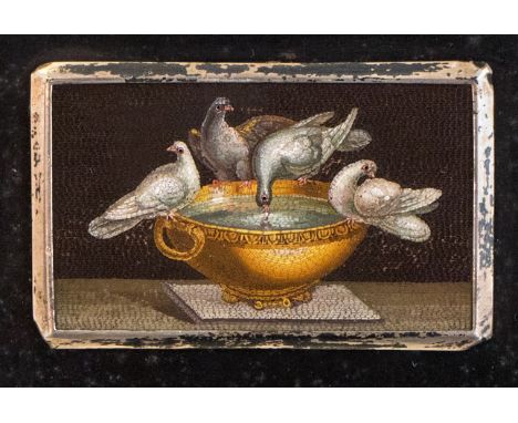 An Italian micromosaic plaque of Plinneys Doves, probably 18th Century, within silver frame, 3.5cm by 6cmm, mounted on a blac