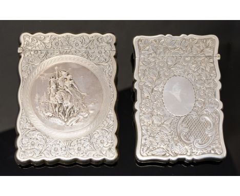 An Edwardian silver shaped rectangular card case, the front chased in relief with lovers on horseback in the Romantic Revival