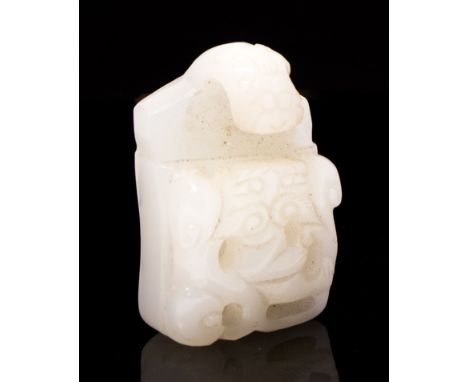 A Chinese pale jade belt hook, probably 19th Century, archaistic style, fret carved, dragon head hook, height 5.5cm