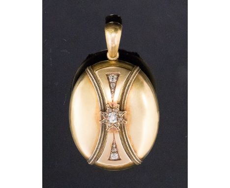 A Victorian diamond set oval locket, central star design diamond cluster with diamond set panels above and below the central 