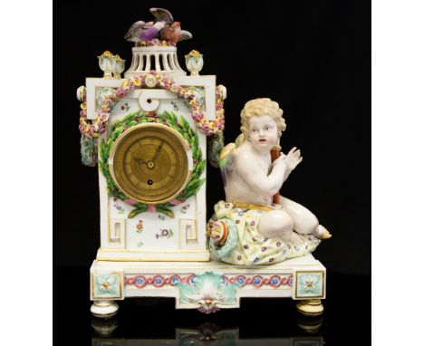 A Meissen clock, engine turned dial, Roman numerals, cherub to one side, birds on reticulated finial, 33cm highCondition: gla