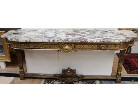 A 19th Century giltwood pier table, in the the manner of Robert Adam. with a marble top, the frame with carved decoration, ra