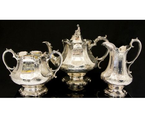 A Victorian silver matched three piece tea service comprising teapot, sugar bowl and milk jug in the Chinoiserie manner, the 