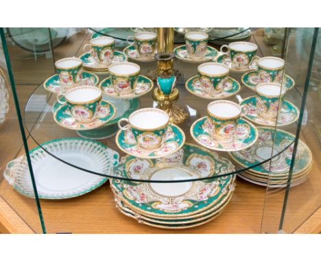 A Copeland part tea service, hand painted floral sprays; together with a similar comport and a pair of ormolu mounted candles