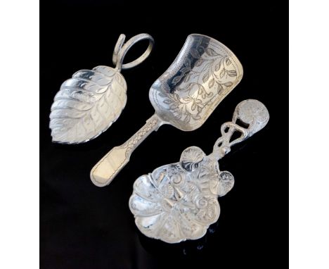 An Elizabeth II ornate cast silver caddy spoon, Sheffield 1998 Hugh Crawshaw, a silver leaf shaped caddy spoon same date and 