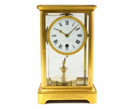 An early 20th Century French gilt metal four glass bracket clock, white enamel Roman dial with retailer's mark for Goldsmiths