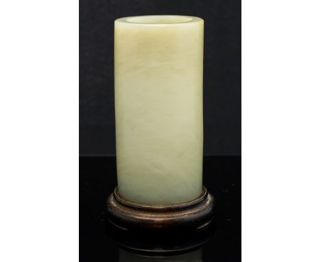 A Chinese celadon jade cylindrical jade brush pot, Qing Dynasty, of grey-green tone, bevelled foot and outside rim, height 10