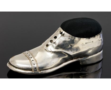 An George V silver large pin cushion cast in the form of a brogue, set on wooden base, S Blanckensee & Son Ltd, Birmingham, 1