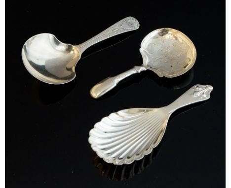 Three 19th/20th Century silver caddy spoons, John Wren, London 1804;  Joseph Willmore, Birmingham 1833 and one with a shell b