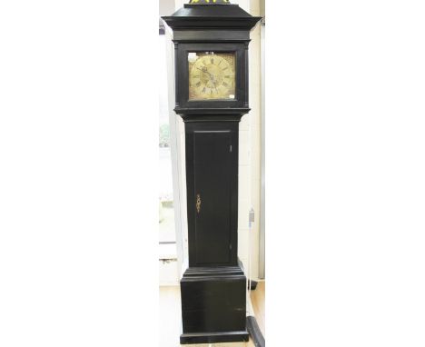A George III 30 hour ebonised longcase clock, 1769 - 86, by John Foot of Liskard, the hood enclosing a 10 inch brass dial and