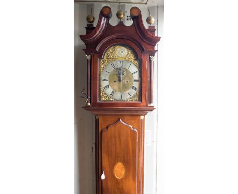 A 19th Century mahogany eight day longcase clock, the hood with a swan neck pediment and ball finials, the glazed door set be