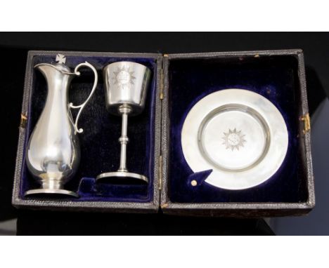 A Victorian silver three-piece travelling communion set consisting of chalice with gilt bowl, paten and wine ewer (the stoppe