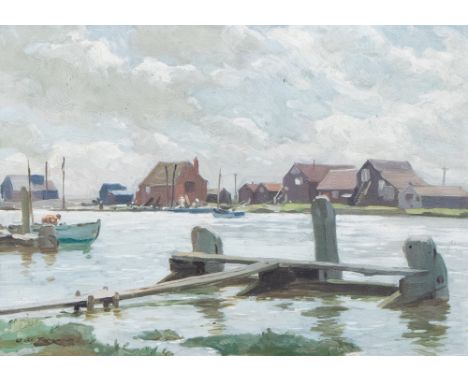 W. M. F.......(British, 20th Century), a river scene with warehouses, signed l.l., oil on board, 25cm by 35cm, framed 