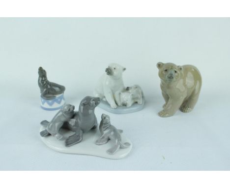 Lladro 'Miniature Polar Bear' 01005434, 'Mini Seal Group' 01005318, 'Balancing Act' 01005392 and a Lladro Bear. Condition - U