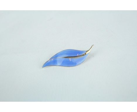 Scandinavian Jewellery: A Norwegian silver gilt brooch of leaf form with blue guilloche enamel decoration. Maker Aksel Holmse