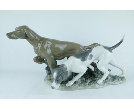 Lladro 'Attentive Dogs', Sculptor: Juan Huerta. Model 01004957, Introduced in 1977 and Retired in 1981. 24cm in height. Condi