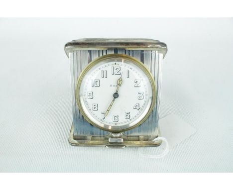 8 Day Sterling Silver Cased travelling clock of Good Quality 
