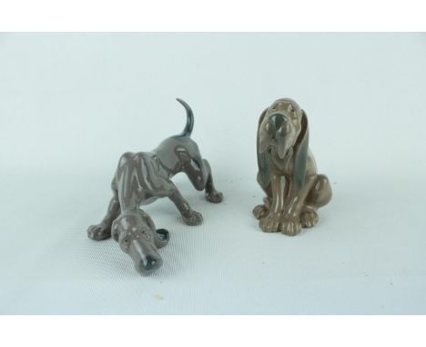 Lladro 'Timid Dog' 01005111 and 'Dog Sniffing' 01005110. Condition - Boxed in Good Condition 