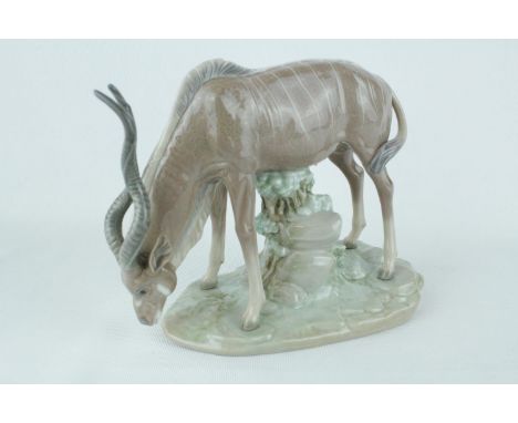 Lladro 'Antelope drinking', Sculptor: Vincente Martinez. Model 01005302, Introduced in 1985 and Retired in 1988. 18cm in heig