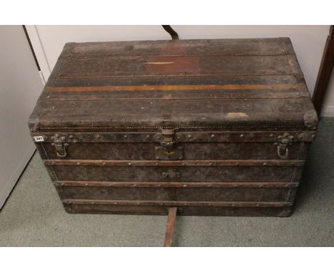 VINTAGE LOUIS VUITTON STEAMER TRUNK an early 20thc steamer trunk, the monogrammed case with wooden bars, metal studs and brac