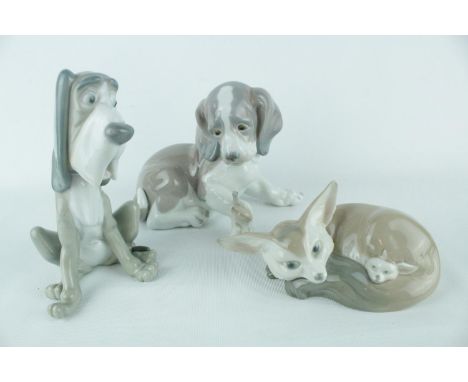 Lladro 'Fox and Cub' 01001065 and 2 Lladro Dogs. Condition - Unboxed Good Overall 