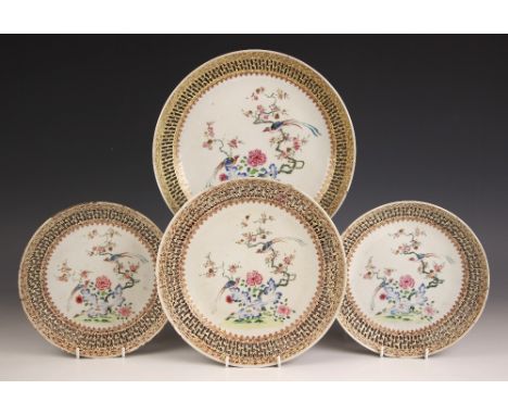 A set of four Chinese porcelain reticulated plates, Qianlong (1736-1795), each circular plate decorate in the famille rose pa