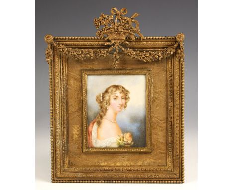 English school (late 18th or early 19th century),A bust length portrait miniature depicting a young lady with a rose,Watercol