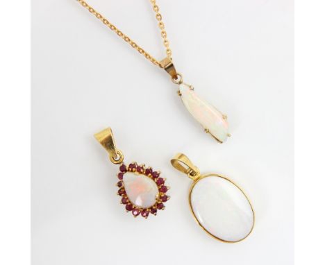 A selection of opal set jewellery, including an oval cabochon pendant within yellow metal rub over mount and plain pendant ba