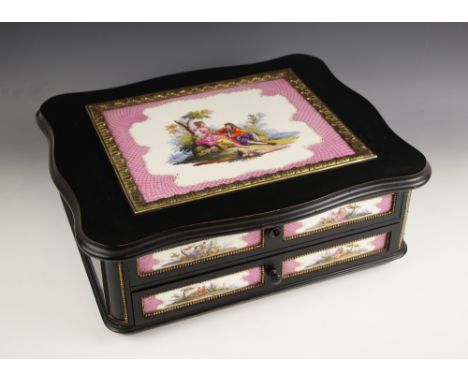 A KPM tile and ebonised ladies toilet box circa 1860, the serpentine outlined hinged cover inset with a KPM tile depicting a 