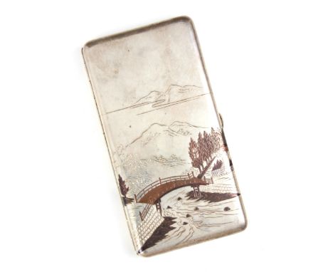 A Japanese niello sterling silver cigarette case, the rectangular body with mountainous scene with bridge and river in front,