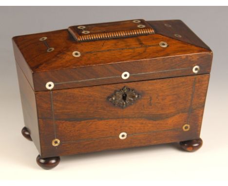 A William IV rosewood and mother of pearl inlaid tea caddy, of sarcophagus form, the mother of pearl roundels linked by strin
